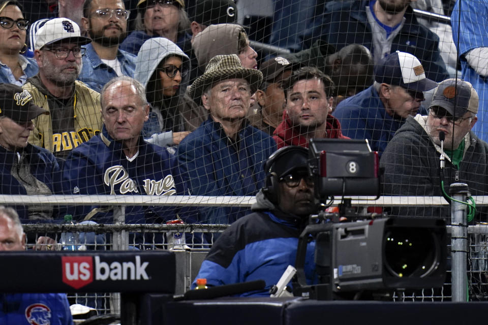 Actor Bill Murray, center, looks on as the Chicago Cubs play the San Diego Padres in a baseball game Tuesday, May 10, 2022, in San Diego. (AP Photo/Gregory Bull)