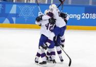 Ice Hockey - Pyeongchang 2018 Winter Olympics - Men's Playoff Match - Slovenia v Norway - Gangneung Hockey Centre, Gangneung, South Korea - February 20, 2018 - Alexander Bonsaksen of Norway celebrates with teammates after scoring a goal in overtime to defeat Slovenia. REUTERS/Grigory Dukor
