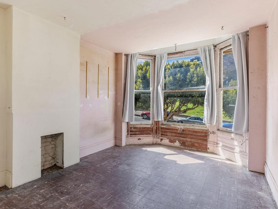 The main front room of the house overlooks Alamo Square Park.