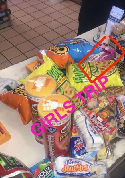 In the pile of junk food you can a box of tampons hidden. Source: Twitter / Snapchat