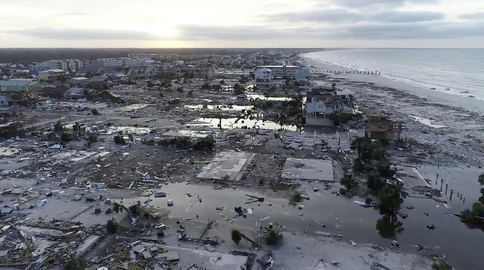 In this image made from video and provided by SevereStudios.com, damage from Hurricane Michael is seen in Mexico Beach, Fla. on Thursday, Oct. 11, 2018. Search-and-rescue teams fanned out across the Florida Panhandle to reach trapped people in Michael's wake Thursday as daylight yielded scenes of rows upon rows of houses smashed to pieces by the third-most powerful hurricane on record to hit the continental U.S. (SevereStudios.com via AP)