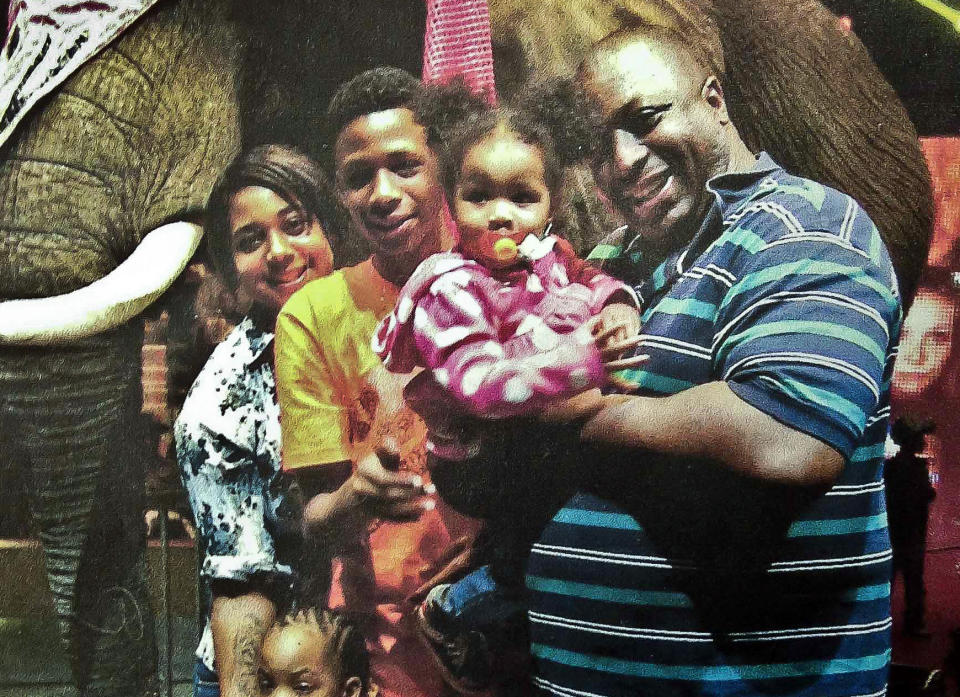 FILE - In this undated family file photo provided by the National Action Network, Eric Garner, right, poses with his children during a family outing. Federal prosecutors won't bring civil rights charges against New York City police officer Daniel Pantaleo in the 2014 chokehold death of Eric Garner, a person familiar with the matter said Tuesday, July 16, 2019. The decision not to bring charges against Pantaleo comes a day before the statute of limitations was set to expire, on the fifth anniversary of the encounter that led to Garner's death. (AP Photo/Family photo via National Action Network, File)