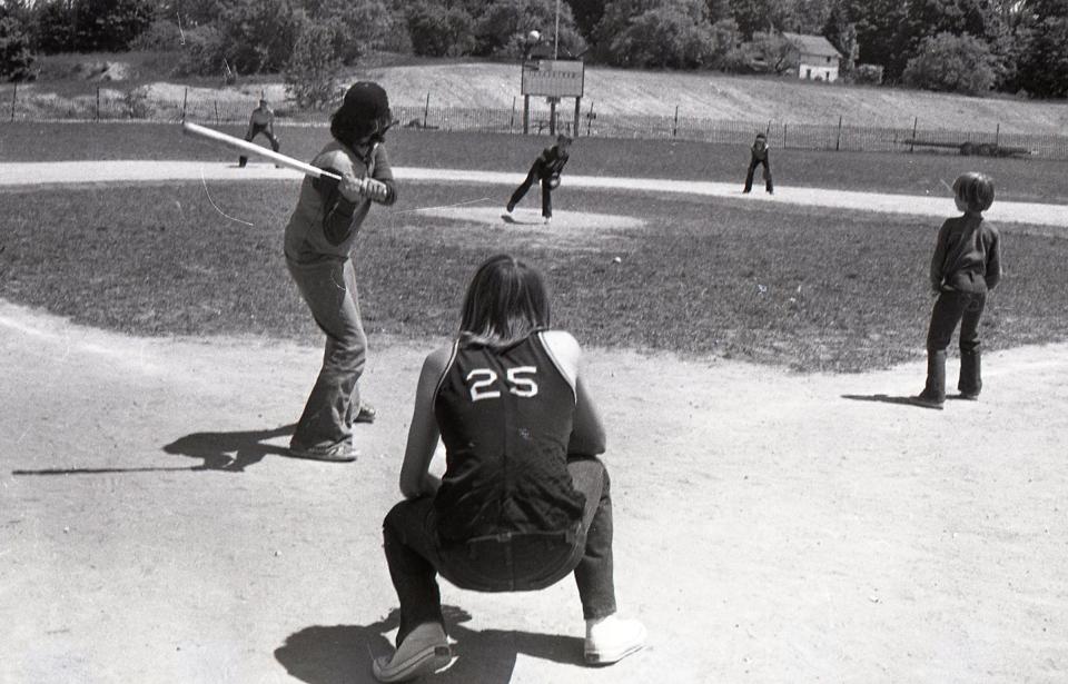 People enjoy a game at the Levering Little League ball field in 1974.
