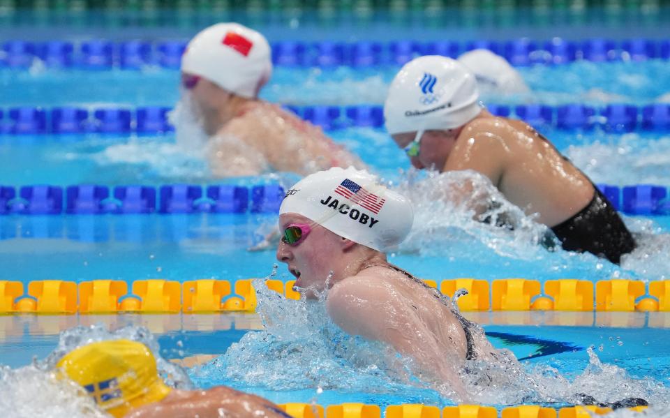 Lydia Jacoby, shown here during the semifinals of the women's 100-meter breaststroke during the 2020 Tokyo Olympics, went on to win gold in the event as well as silver in the 400-meter medley relay. She's joining a Texas program this fall that just finished runner-up in the NCAA swimming and diving championships.