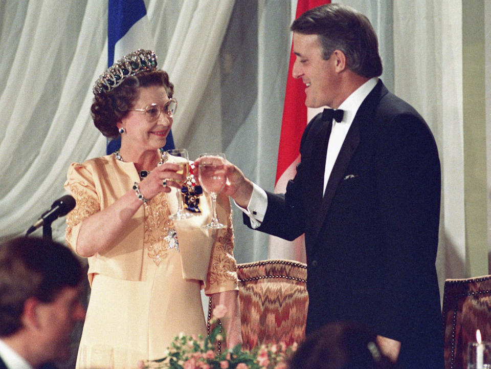 Queen Elizabeth II toasts with Canadian Prime Minister Brian Mulroney in Quebec City, Oct. 23, 1987. Mulroney has died at the age of 84, his daughter Caroline Mulroney posted on social media, Thursday, Feb. 29, 2024. (Ron Poling/The Canadian Press via AP)