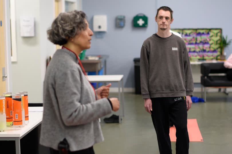 Caroline Phipps takes a yoga class at the jail.