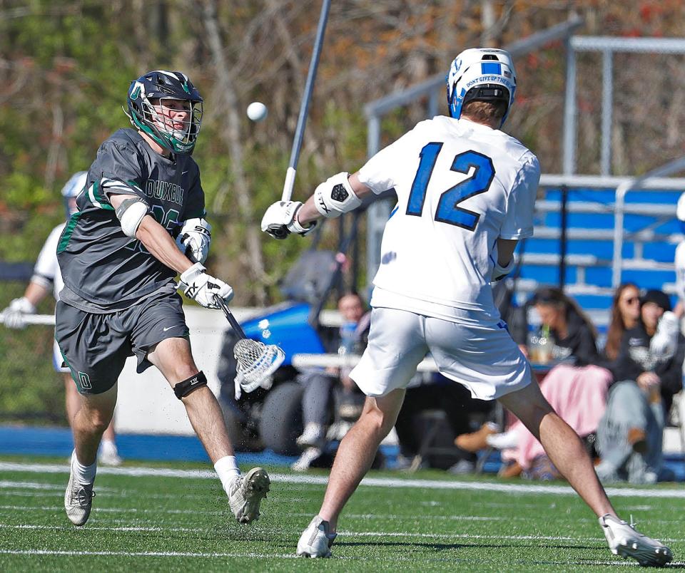 Duxbury's Wyatt Glass takes a shot during a game against Scituate in 2022.