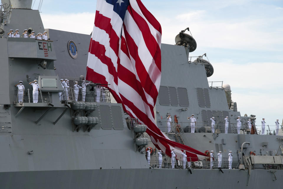 U.S. Navy sailors aboard the USS Michael Murphy salute as they pass in review during the official ceremonies marking the 75th anniversary of the Japanese surrender that ended World War II, in Honolulu, Wednesday, Sept. 2, 2020. (Craig T. Kojima/Honolulu Star-Advertiser via AP, Pool)