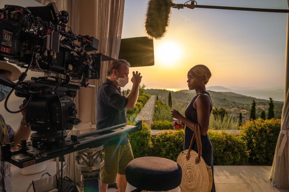 Director Rian Johnson works with star Janelle Monáe on the set of "Glass Onion."