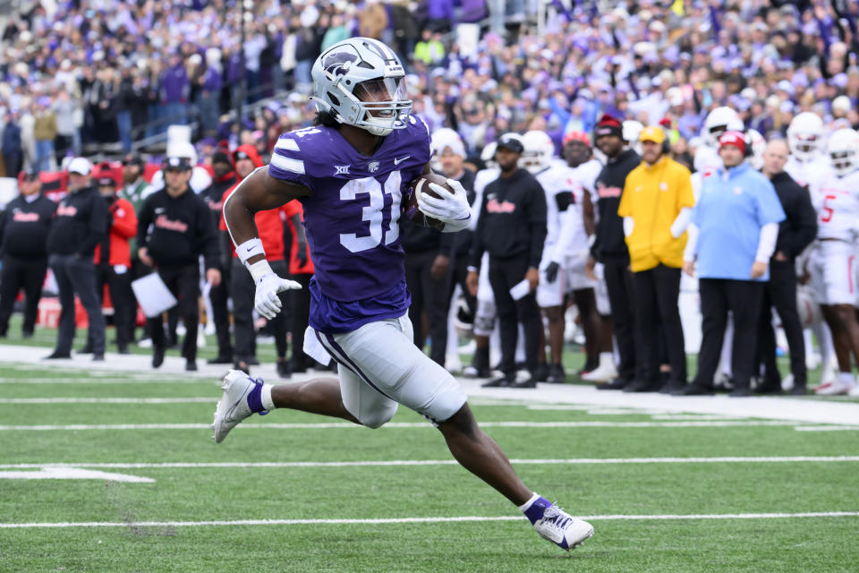 Kansas State running back DJ Giddens carries the ball in for a touchdown against Houston during the first half of an NCAA college football game in Manhattan, Kan., Saturday, Oct. 28, 2023. (AP Photo/Reed Hoffmann)