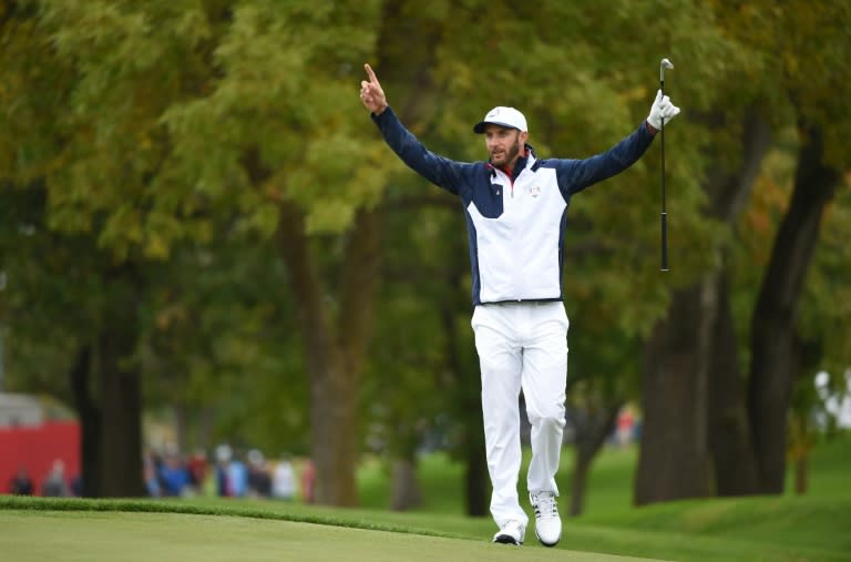 Team USA player Dustin Johnson gestures during a practice round ahead of the 41st Ryder Cup at Hazeltine National Golf Course