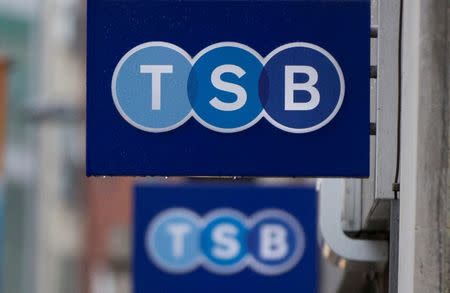 FILE PHOTO: Signs are seen outside of a branch of TSB bank in London May 27, 2014. REUTERS/Neil Hall/File Photo