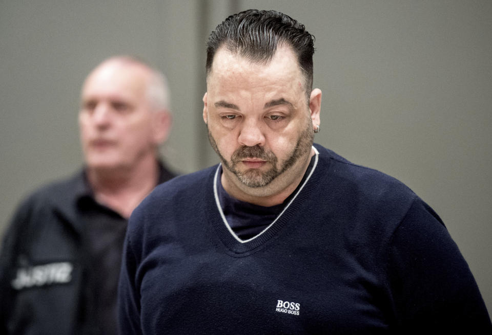 Former nurse Niels Hoegel, right, accused of multiple murder and attempted murder of patients, arrives for a session of the district court in Oldenburg, Germany, Thursday, June 6, 2019. (Hauke-Christian Dittrich/dpa via AP)