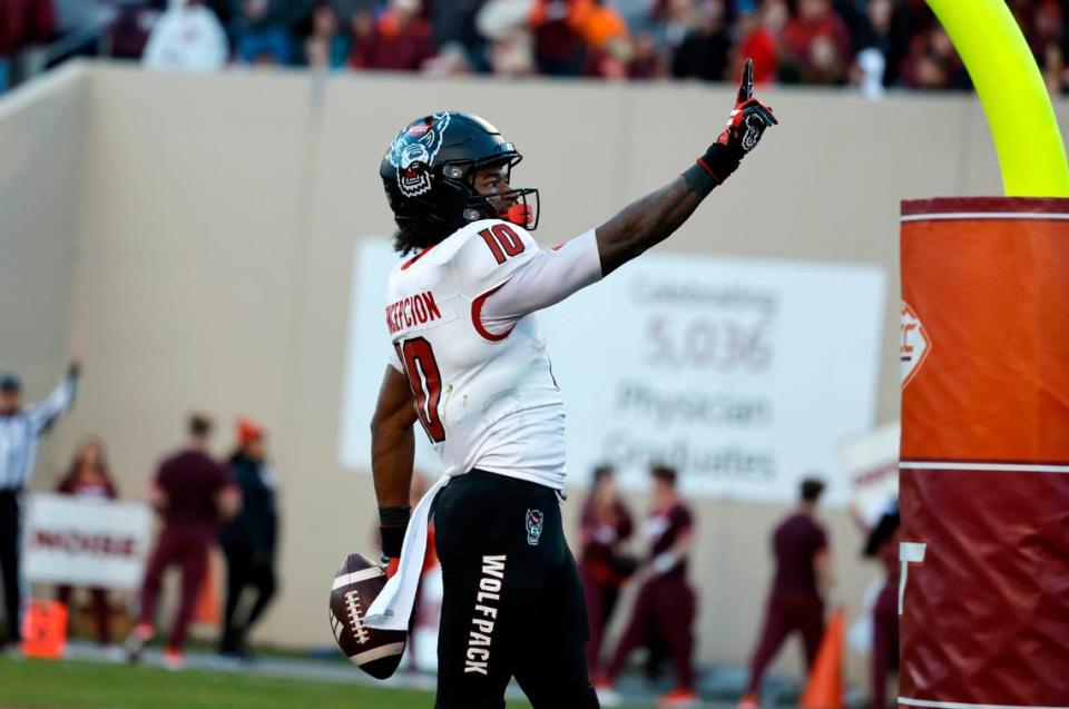 N.C. State wide receiver KC Concepcion (10) motions to the crowd after scoring on a 28-yard touchdown reception during the first half of N.C. State’s game against Virginia Tech at Lane Stadium in Blacksburg, VA, Saturday, Nov. 18, 2023.