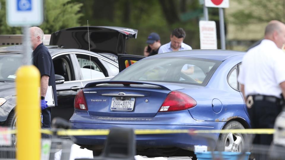 Police respond to the scene of a shooting in the parking lot of a supermarket where several people were killed in a shooting, Saturday, May 14, 2022 in Buffalo, N.Y. Officials said the gunman entered the supermarket with a rifle and opened fire. Investigators believe the man may have been livestreaming the shooting and were looking into whether he had posted a manifesto online.