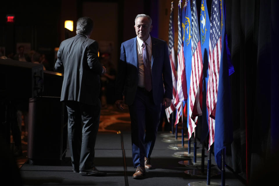 Clark County Sheriff Joe Lombardo, Republican candidate for governor of Nevada, right, leaves the stage after speaking to supporters during an election night campaign event Tuesday, Nov. 8, 2022, in Las Vegas. (AP Photo/John Locher)