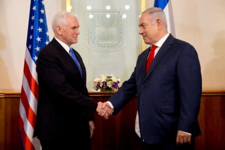 U.S. Vice President Mike Pence shakes hands with Israeli Prime Minister Benjamin Netanyahu during a meeting at the Prime Minister's office in Jerusalem January 22, 2018. REUTERS/Ariel Schalit/Pool