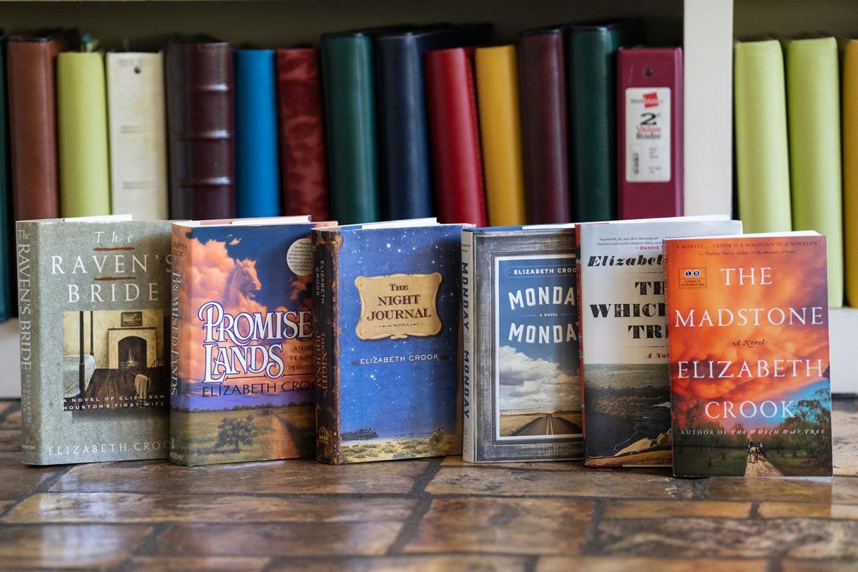 Elizabeth Crook has written six historical novels, all published by major presses. These are their original book jackets. Crook also reserves a place in her bookish house for books by people she knows personally.