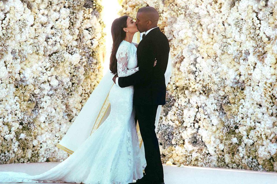 Courtesy Def Jam Kim Kardashian and Kanye West kissing at their 2014 wedding