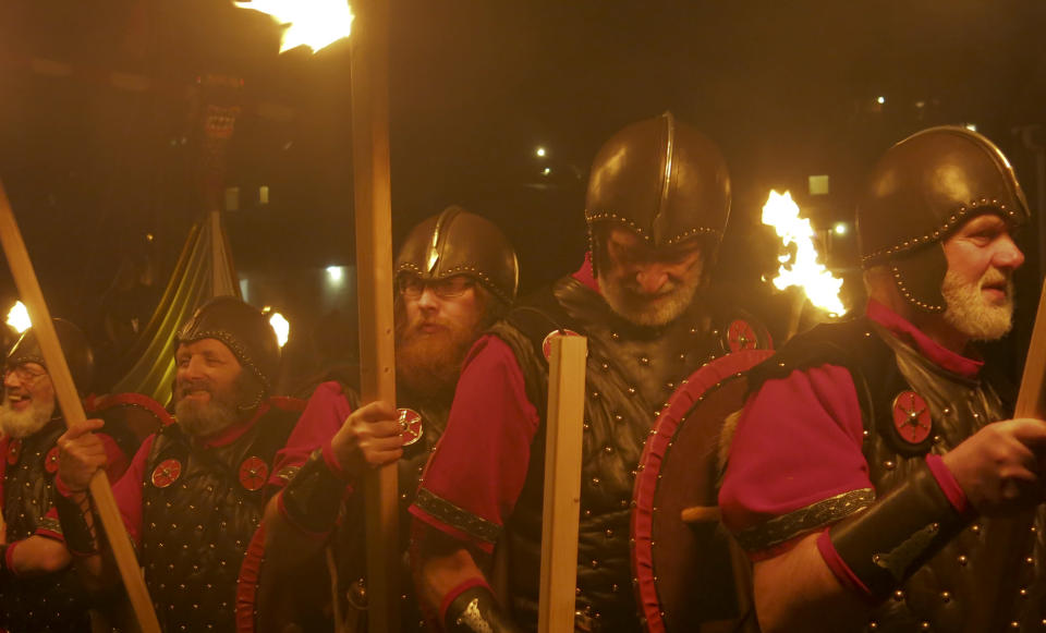 <p> In this photo taken March 14, 2014, locals dressed as Vikings carry torches as they take part in the annual Up Helly Aa, Viking fire festival in Gulberwick, Shetland Islands north of mainland Scotland. The fearsome-looking participants in the festival live in Scotland's remote Shetland Islands, a wind-whipped northern archipelago where many claim descent from Scandinavian raiders. They are cool to the idea of Scotland leaving Britain to form an independent nation, and determined that their rugged islands will retain their autonomy whatever the outcome of September’s referendum. (AP Photo/Jill Lawless) </p>