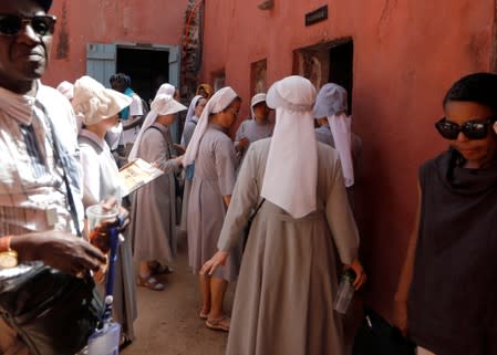 Nuns visit the male section of the 'Maison Des Esclaves' slaves house, a gathering point where slaves were shipped west in the 1700s and 1800s, at Goree Island off the coast of Dakar