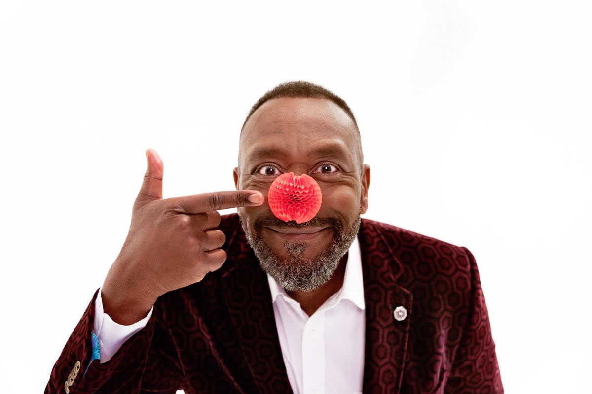 Sir Lenny Henry proudly shows off the latest red nose design 