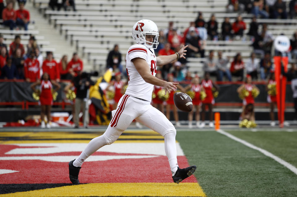 FILE - In this Oct. 13, 2018, fikle photo, Rutgers punter Adam Korsak punts the ball in the first half of an NCAA college football game against Maryland, in College Park, Md. The Big Ten Conference knows the value of having good punters, and they are sometimes willing to go a long way to get them. Korsak is a former Australian rules football player who trained at ProKick Australia before coming to the United States. (AP Photo/Patrick Semansky, File)