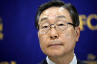 Tomihiro Tanaka, right, the President of Family Federation for World Peace and Unification poses prior to a press conference Wednesday, Aug. 10, 2022, in Tokyo. Tanaka denied any “political interference” with specific political parties and said Prime Minister Kishida’s call for his party members to distance themselves from the church was “regrettable.” Kishida reshuffled his Cabinet on Wednesday in an apparent bid to distance his administration from the Unification Church, whose ties to the assassinated leader Shinzo Abe and senior ruling party leadership caused a major drop in approval ratings. (AP Photo/Eugene Hoshiko)