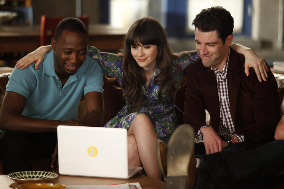 In this undated image released by Fox, Zooey Deschanel appears with Max Greenfield, right, and Lamorne Morris, left, in a scene from the comedy "New Girl," airing Tuesdays at 9:00 p.m. EST on Fox. (AP Photo/Fox, Patrick McElhenney)