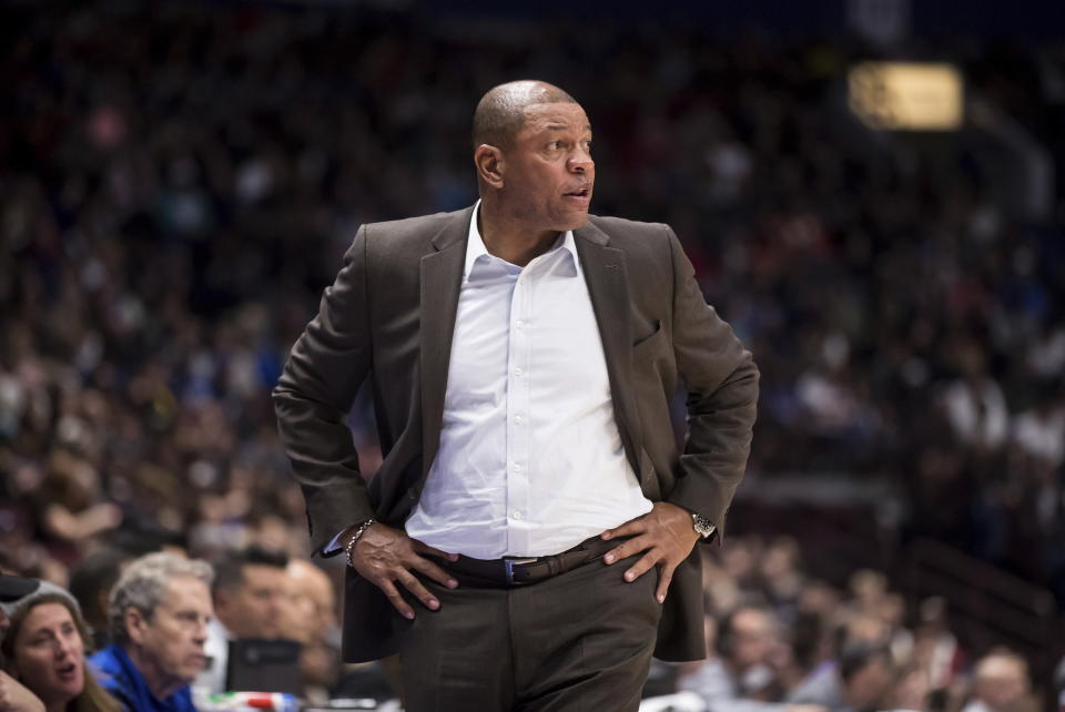 Los Angeles Clippers coach Doc Rivers watches from the sideline during the second half of the team's NBA preseason basketball game against the Dallas Mavericks on Thursday, Oct. 17, 2019, in Vancouver, British Columbia. (Darryl Dyck/The Canadian Press via AP)