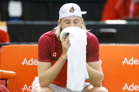 Tennis - Canada v Britain - Davis Cup World Group First Round - Ottawa, Ontario, Canada - 5/2/17. Canada's Denis Shapovalov reacts after the umpire was struck by a ball during his singles match against Britain's Kyle Edmund. REUTERS/Chris Wattie