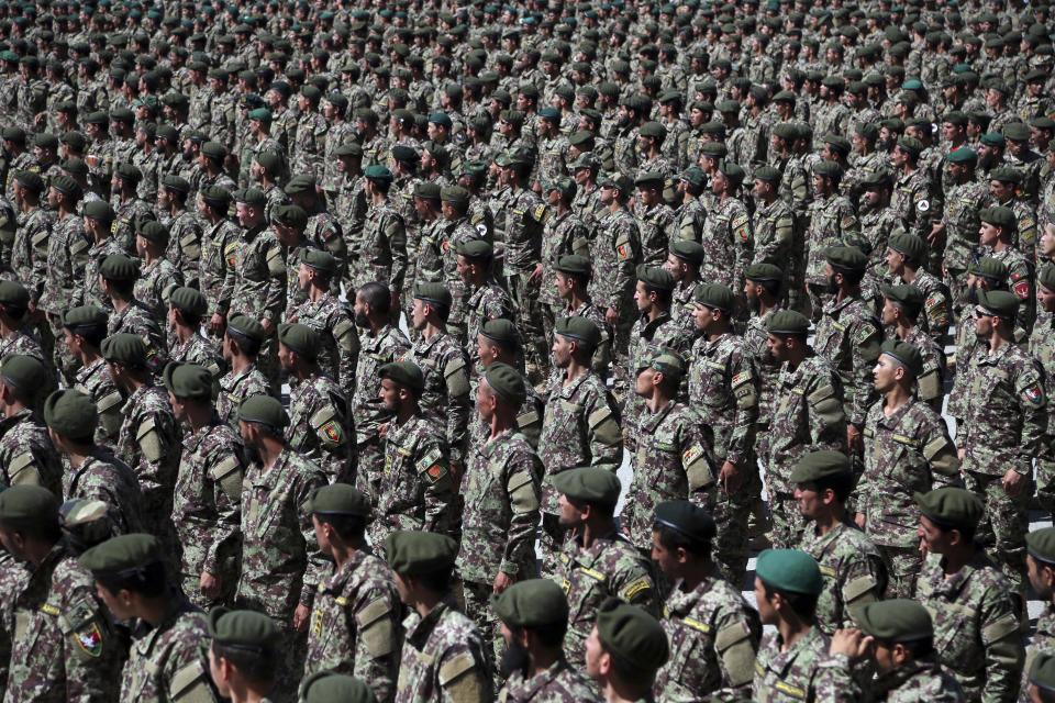 Afghan National Army soldiers attend their graduation ceremony from a 3-month training program at the Afghan Military Academy in Kabul, Afghanistan, Monday, May 27, 2019. (AP Photo/Rahmat Gul)