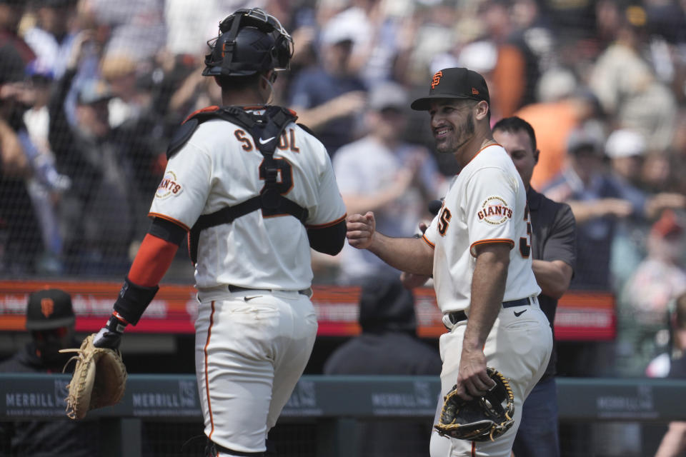 San Francisco Giants position player David Villar, right, celebrates with catcher Blake Sabol after pitching against the San Diego Padres during the ninth inning of a baseball game in San Francisco, Thursday, June 22, 2023. The Padres won 10-0. (AP Photo/Jeff Chiu)