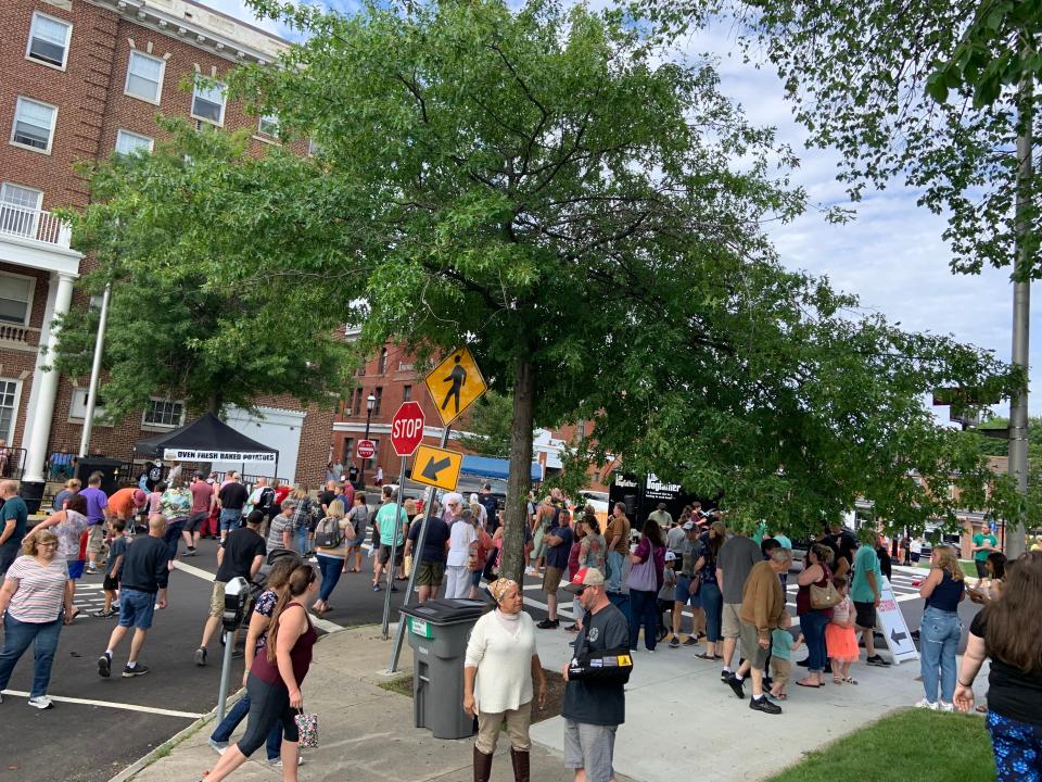 A crowd gathers at the Get Baked Potato Company truck at the 4th annual Food Truck Festival in Gardner on July 10, 2021.