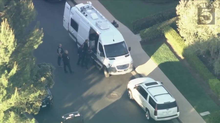 Law enforcement officials outside the scene of a possible home invasion in Newport Beach, CA on April 16, 2024. (Sky5)