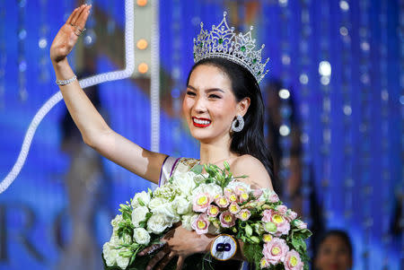 Contestant Jiratchaya Sirimongkolnawin of Thailand waves after she was crowned winner of the Miss International Queen 2016 transgender/transsexual beauty pageant in Pattaya, Thailand, March 10, 2017. REUTERS/Athit Perawongmetha