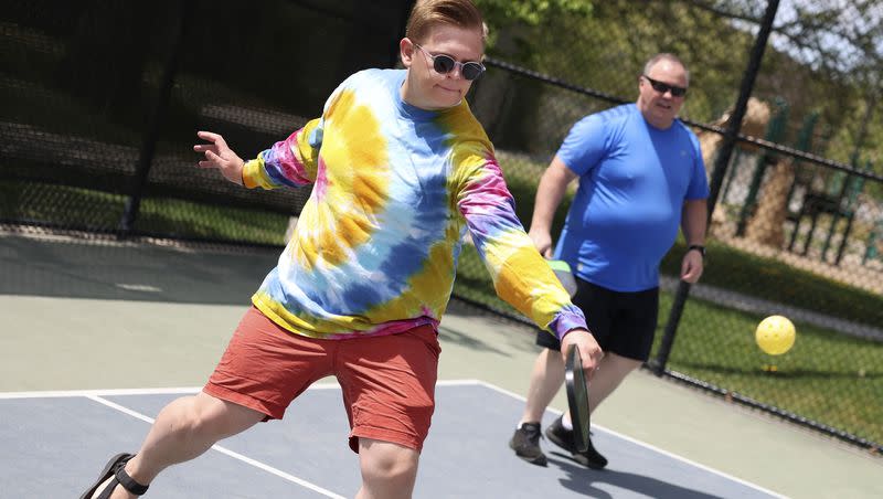 James Ostergar and Mark Mitchell play pickleball with co-workers during a staff picnic at Fairmont Park in Salt Lake City on May 12, 2023. One survey says Utah is the No. 1 state for pickleball.