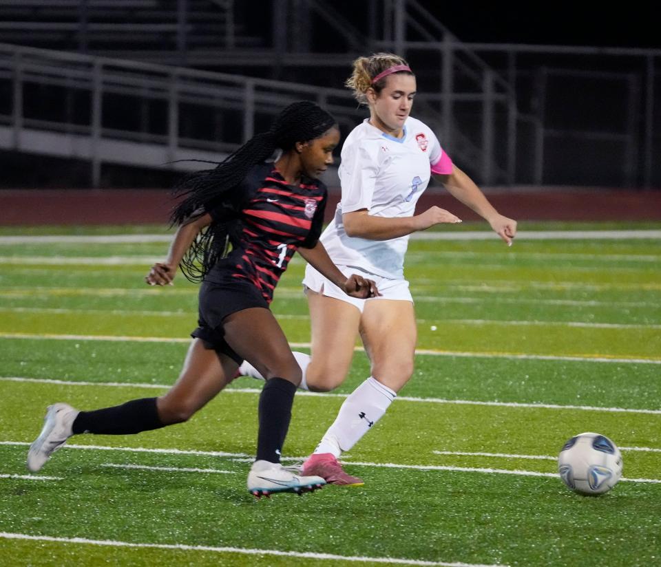 Seabreeze's Morgan Long battles with New Smyrna Beach's Celeste Coney (3) during girls soccer match at New Smyrna Sports Complex, Tuesday, Dec.12, 2023.