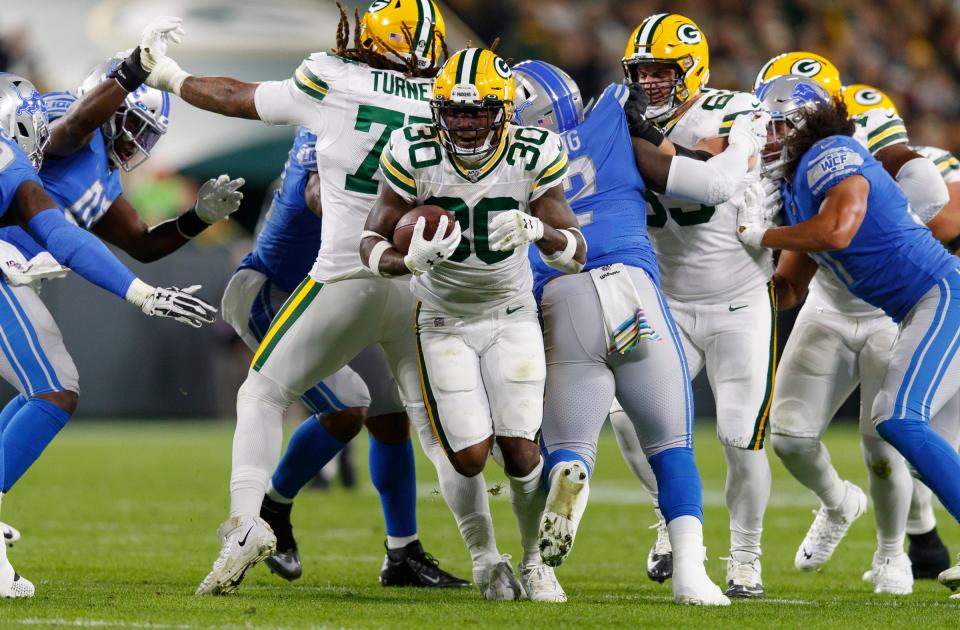 Green Bay Packers running back Jamaal Williams rushes with the football during the second quarter against the Detroit Lions at Lambeau Field in Green Bay, Wis., Oct. 14, 2019.