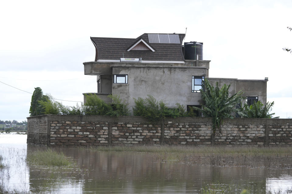 A partially submerged house is seen in Machakos county, Kenya Monday, April 22, 2024. Heavy rains pounding different parts of Kenya have led to the deaths of at least 13 people and displaced some 15,000, the United Nations said, as forecasters warned more rains can be expected until June. (AP Photo/Brian Inganga)