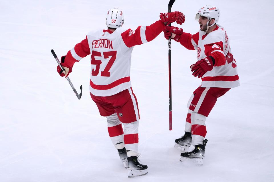 Red Wings forward David Perron, left, celebrates with Shayne Gostisbehere after scoring a goal during the third period of the Wings' 5-3 win on Tuesday, Jan. 2, 2024, in San Jose, California.