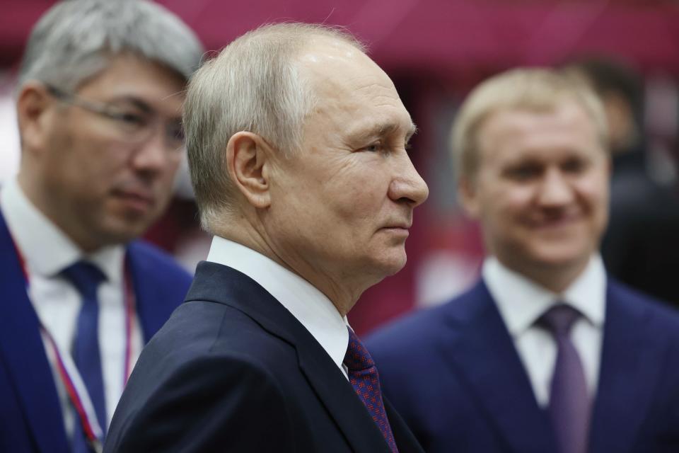 Russian President Vladimir Putin, center, accompanied by Ulan-Ude Aviation Plant CEO Alexey Kozlov, right, and the head of Buryatia region Alexey Tsydenov, left, visits the Ulan-Ude Aviation Plant, a part of the Rostec's Russian Helicopters manufacturing company in Ulan-Ude, Republic of Buryatia, eastern Russia, Tuesday, March 14, 2023. (Mikhail Metzel, Sputnik, Kremlin Pool Photo via AP)