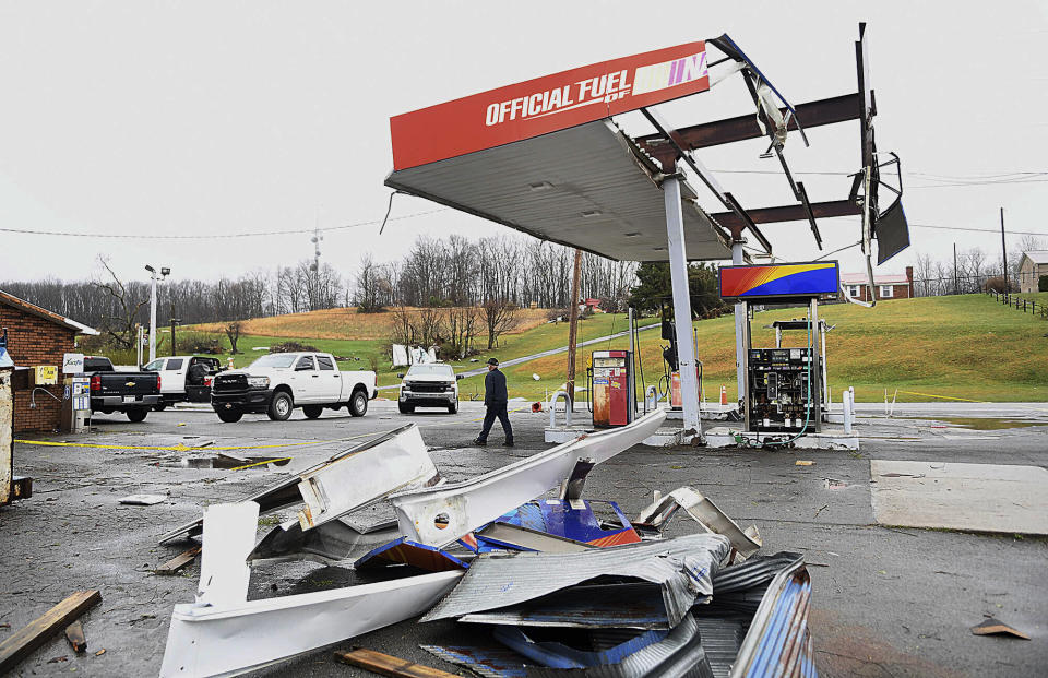 The canopy of a gas station is strewn about the ground, Wednesday, April 3, 2024, outside the Par Mar convenience store off Route 60 in Hico, W.Va., after a storm hit the area the night before. (Rick Barbero/The Register-Herald via AP)