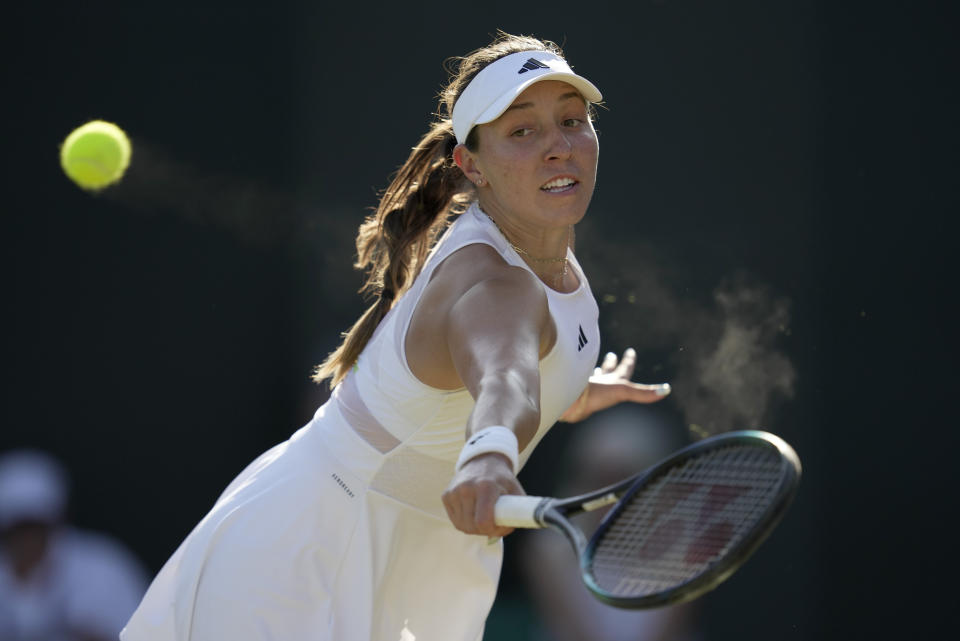 Jessica Pegula of the US returns to Italy's Elisabetta Cocciaretto in a women's singles match on day five of the Wimbledon tennis championships in London, Friday, July 7, 2023. (AP Photo/Kin Cheung)