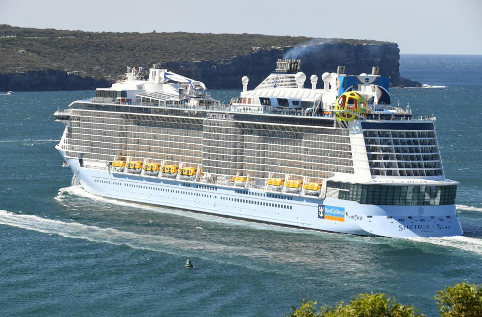 SYDNEY, AUSTRALIA - APRIL 04: Royal Caribbean's cruise ship, Spectrum of the Seas is escorted by Australian Border Vessels and Maritime Police as it departs Sydney Harbour on April 04, 2020 in Sydney, Australia. The Australian Government is working to move several ships out of New South Wales waters, in line with a 30-day ban on foreign ships docking in Australia ports imposed in March. The government has been attacked by commentators and the public for its handling of the Ruby Princess, a ship that docked in Sydney and is linked to over 500 of Australia's Covid-19 cases throughout multiple states and territories.  (Photo by James D. Morgan/Getty Images)