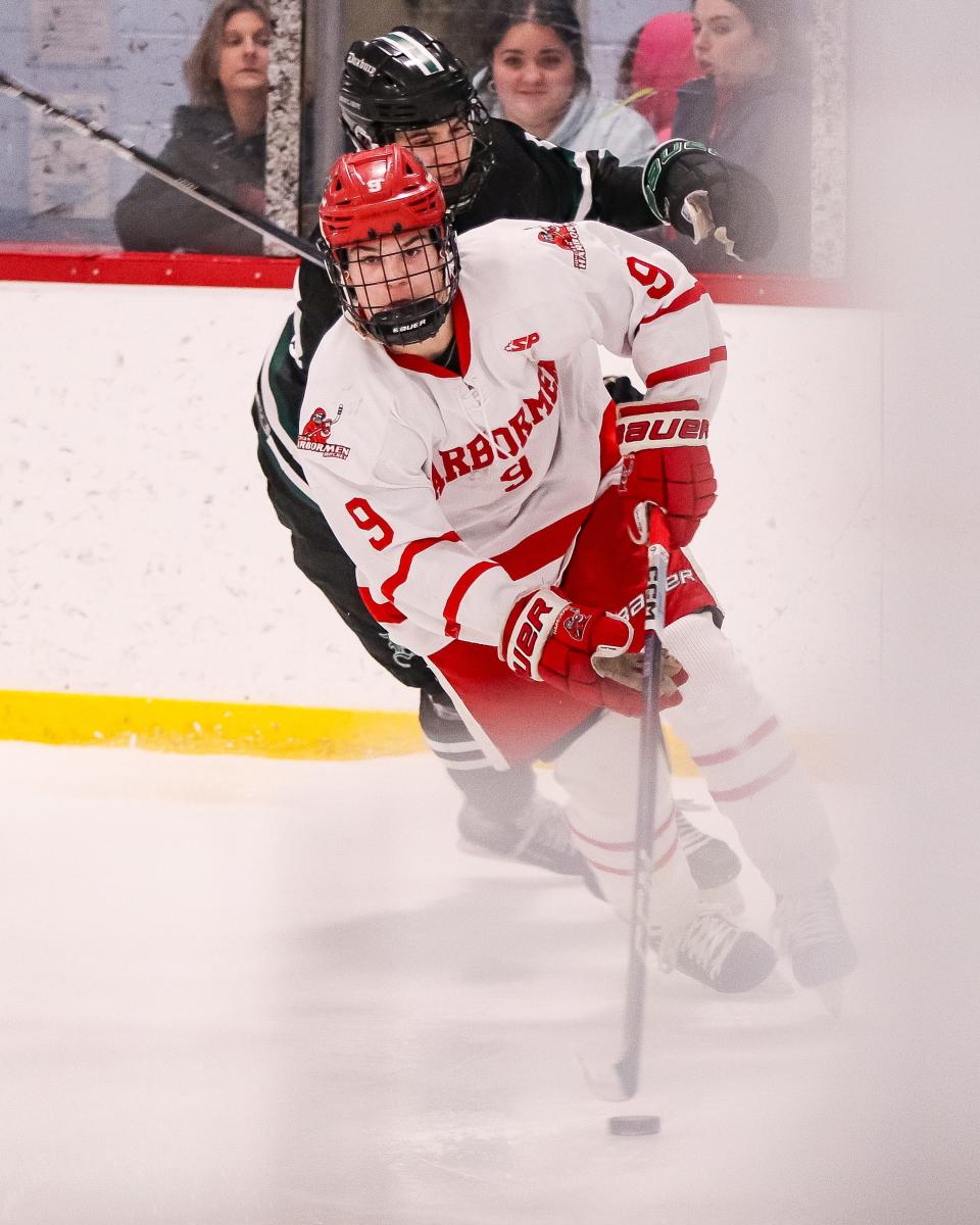 Hingham's Cam McKenna handles the puck during a game against Duxbury at Pilgrim Skating Arena in Hingham on Monday, January 29, 2024.