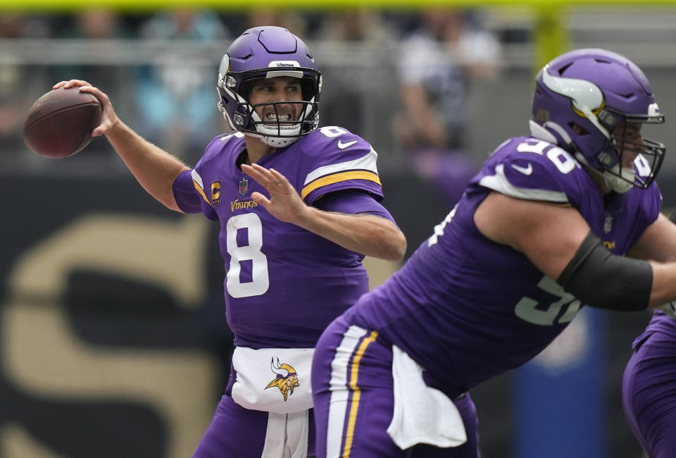 Minnesota Vikings quarterback Kirk Cousins (8) passes the ball during an NFL match between Minnesota Vikings and New Orleans Saints at the Tottenham Hotspur stadium in London, Sunday, Oct. 2, 2022. (AP Photo/Frank Augstein)