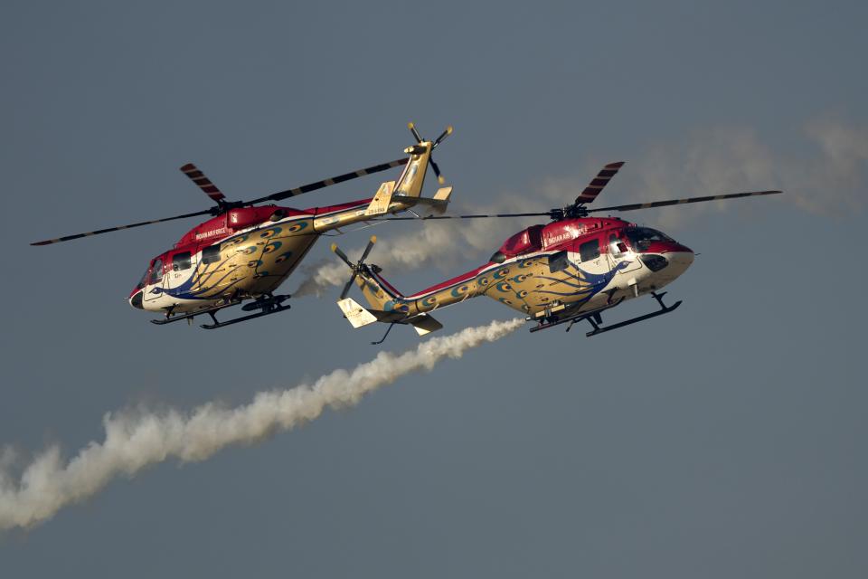 Sarang helicopter display team from India, perform during second day of the Dubai Air Show, United Arab Emirates, Tuesday, Nov. 14, 2023. (AP Photo/Kamran Jebreili)
