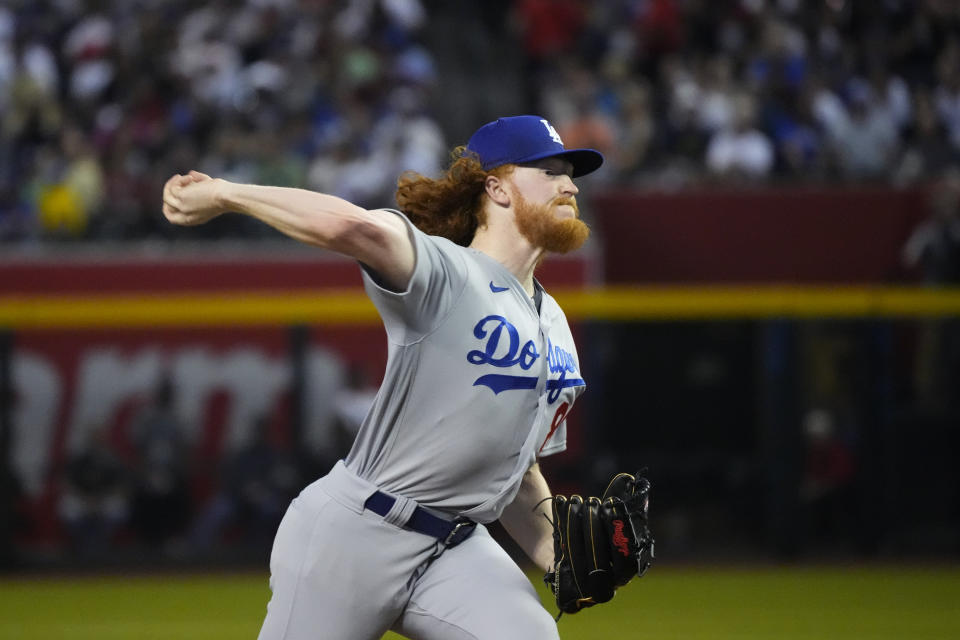 Los Angeles Dodgers starting pitcher Dustin May throws against the Arizona Diamondbacks during the first inning of a baseball game Thursday, April 6, 2023, in Phoenix. (AP Photo/Ross D. Franklin)