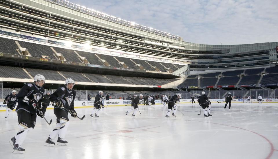 The Pittsburgh Penguins practice on the Soldier Field ice for Saturday's Stadium Series NHL hockey game between the Penguins and the Chicago Blackhawks, Friday, Feb. 28, 2014, in Chicago. (AP Photo/Charles Rex Arbogast)